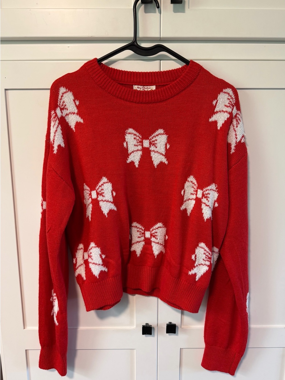 Merry Christmas by Poof New York  Red Crewneck Sweater with White Bow Pattern